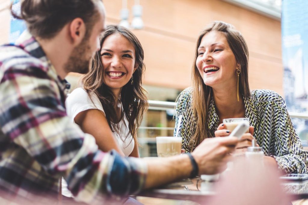 three people talking with each other